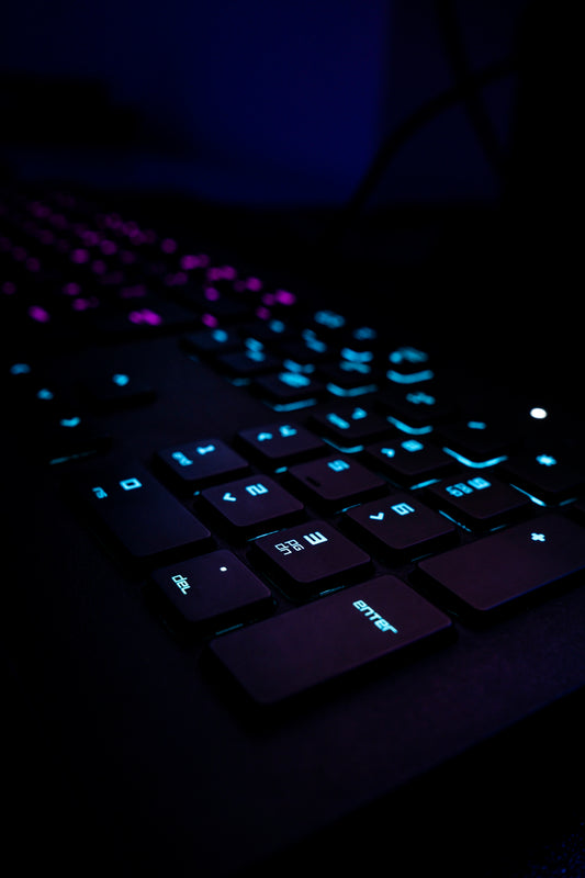black computer keyboard on blue textile
