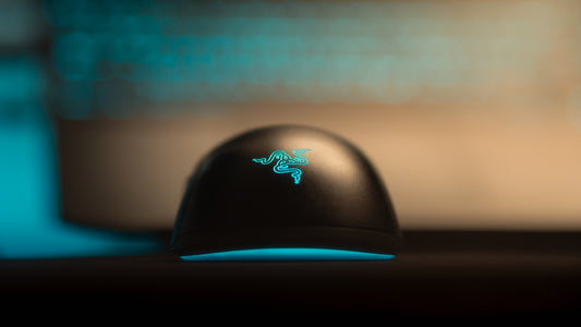 Black gaming mouse with glowing blue accents
