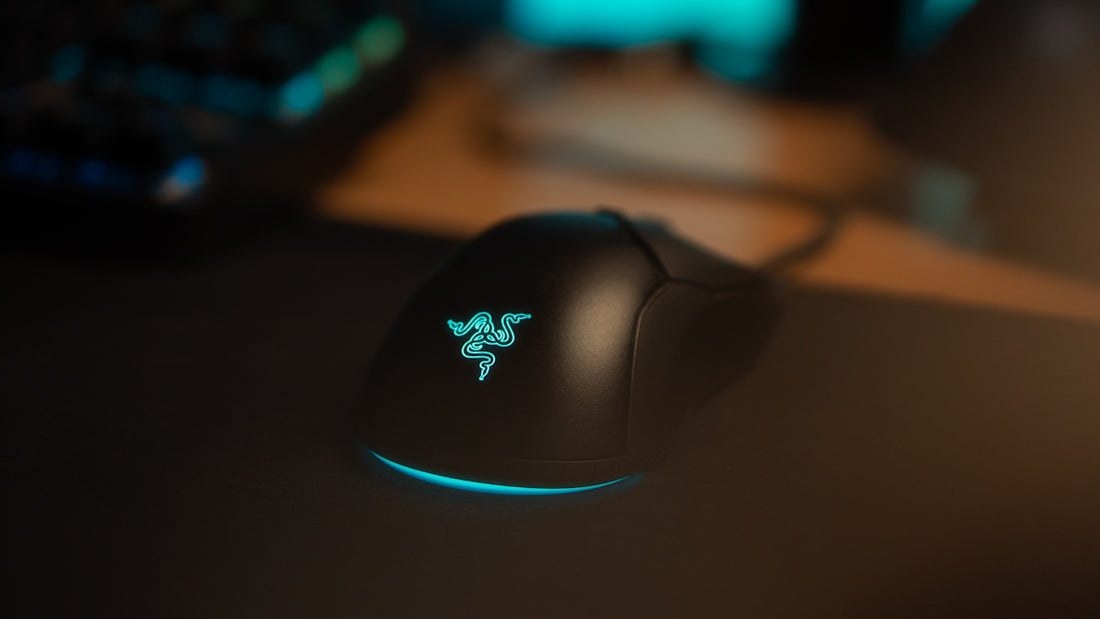 A black gaming mouse with glowing blue accents.