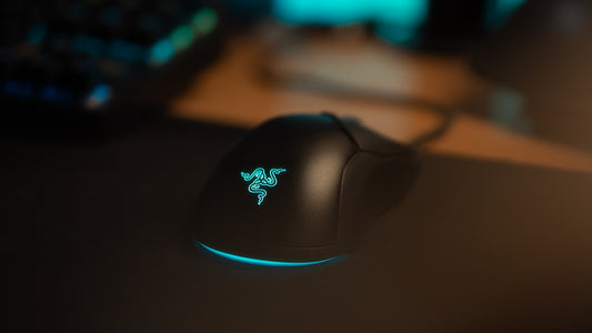 A black gaming mouse with glowing blue accents.